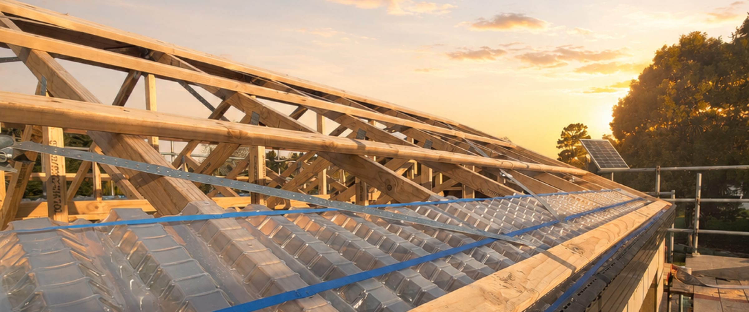 Roof trusses and purlins on a Paragon Portables home at golden hour