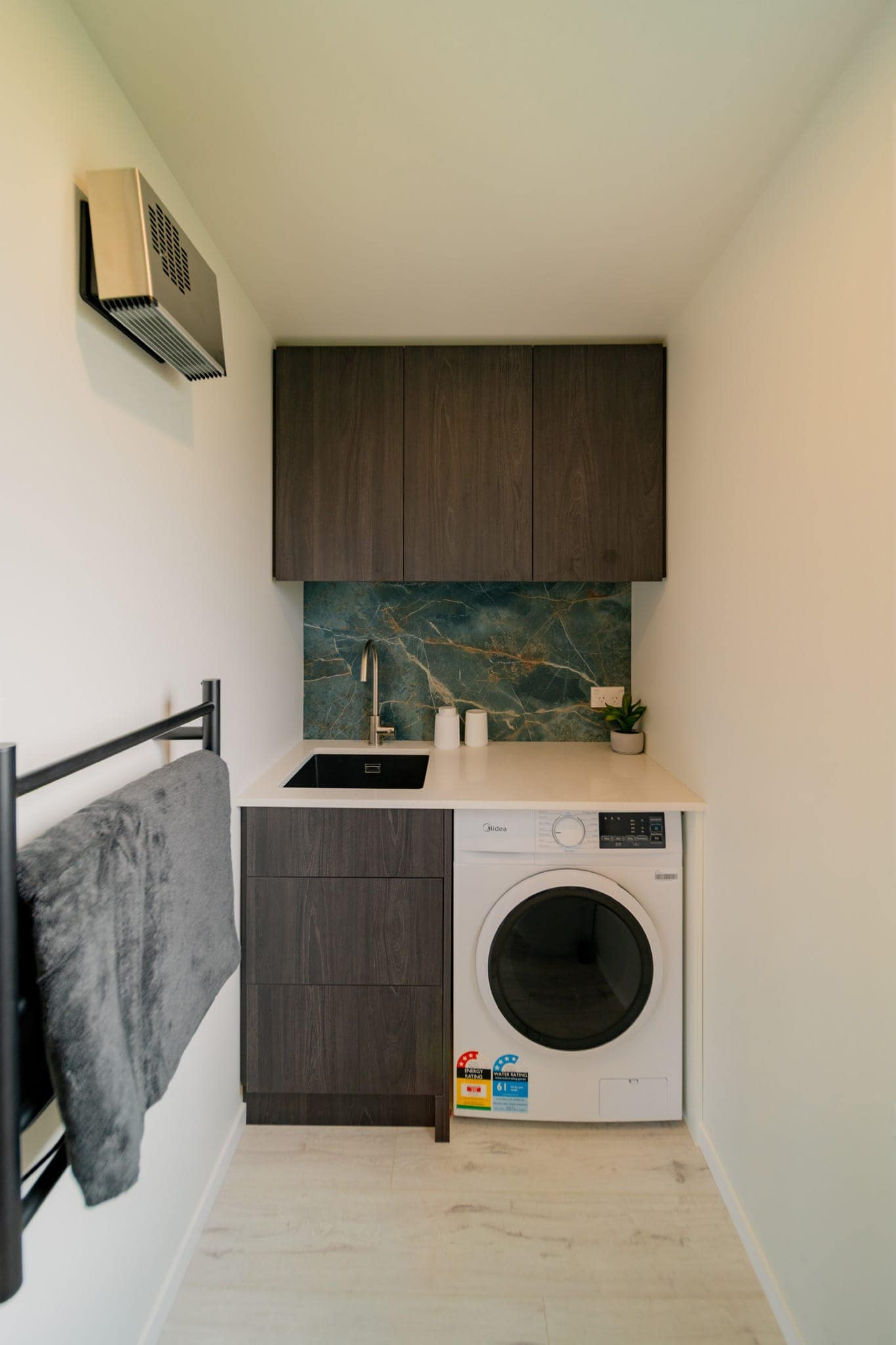Laundry with integrated joinery and heated towel rail
