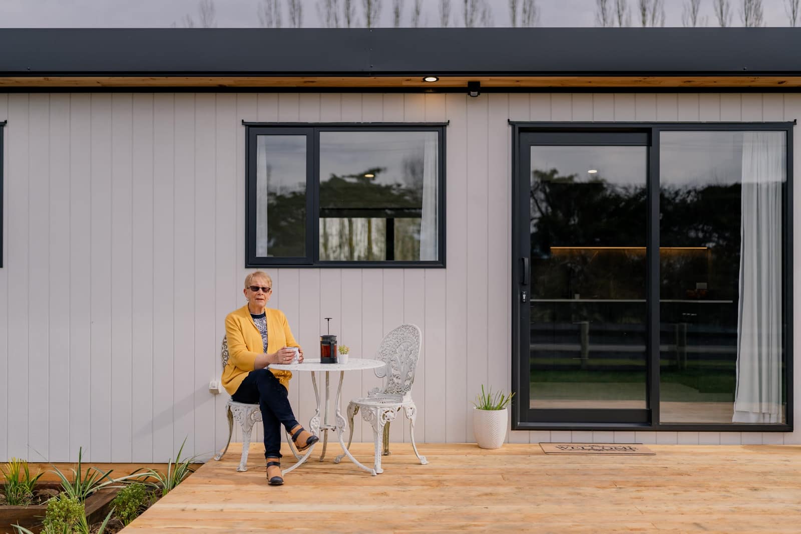 A client on the deck of her finished Paragon Portables home