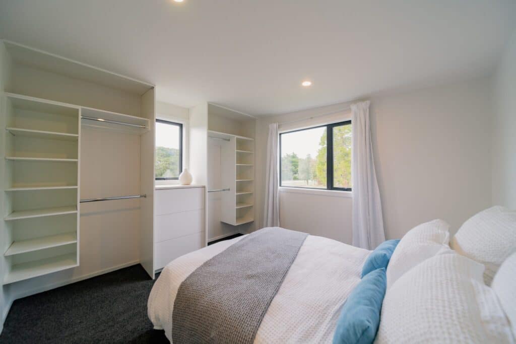 Bedroom with built-in wardrobes in a Paragon Portables home