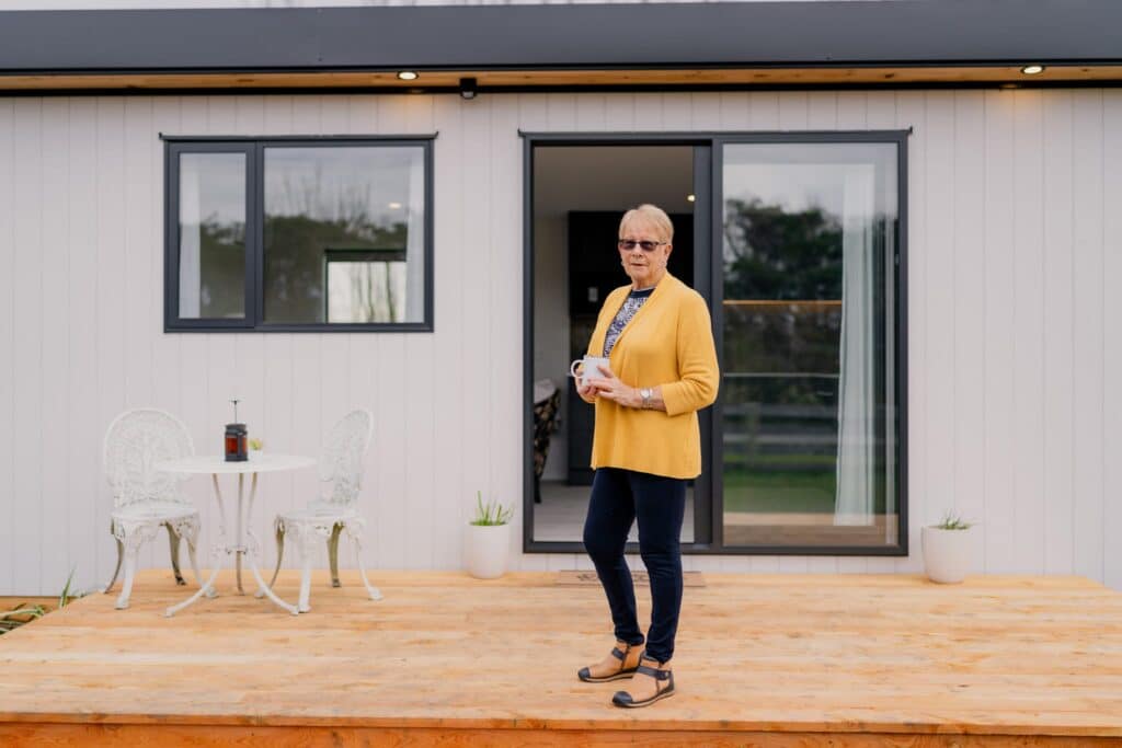 A client on the deck of her finished Paragon Portables home