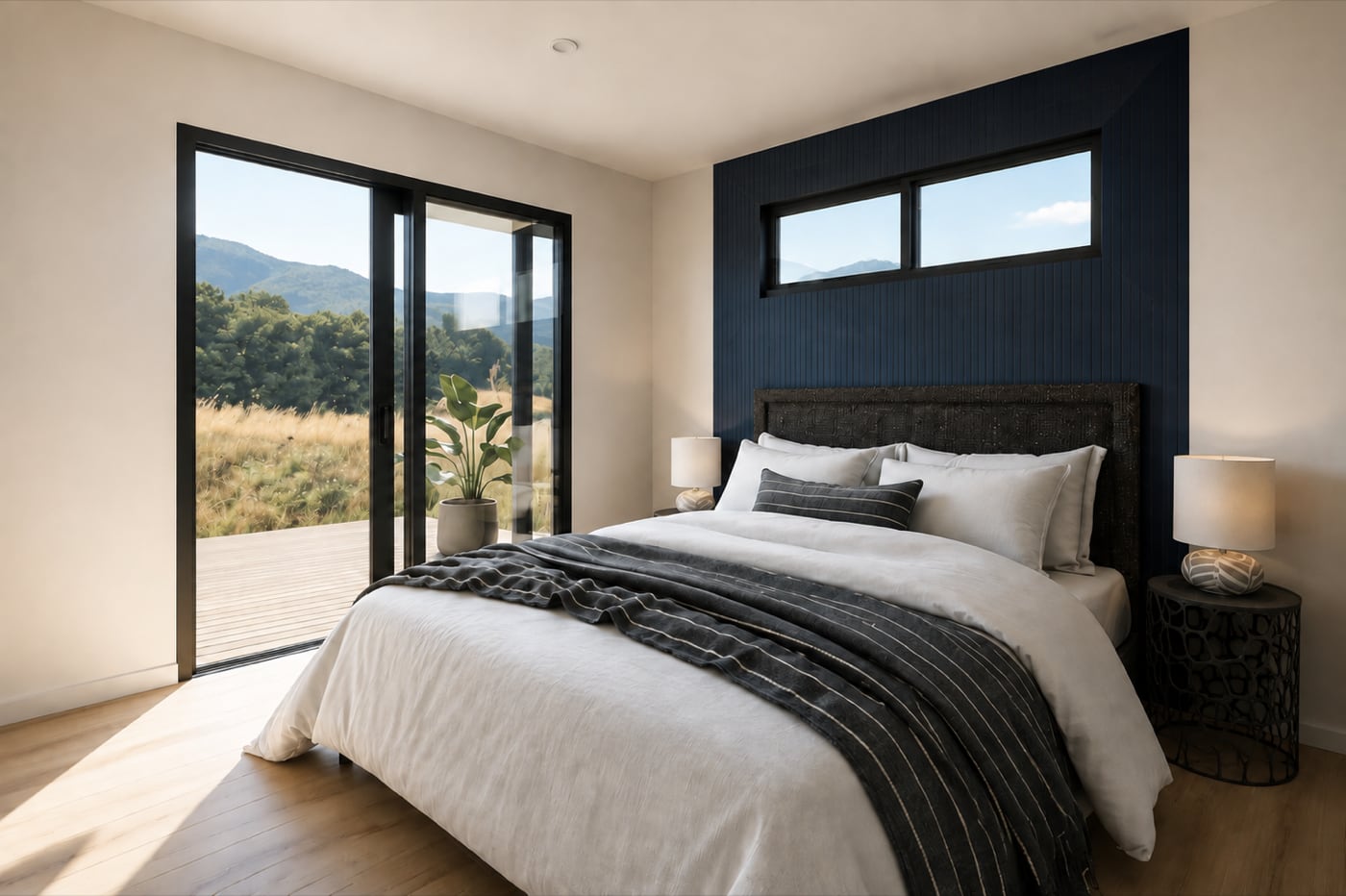 Modern bedroom interior with sliding glass doors opening to a deck in a Paragon Portables one-bedroom portable home