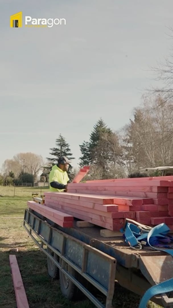 Paragon Portables crew unloading framing timber and cutting on site in North Canterbury